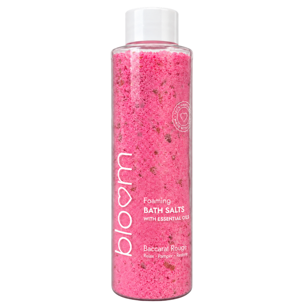 Bloom Baccarat Rouge Foaming Bath Salts in a clear bottle with pink salts and a white cap