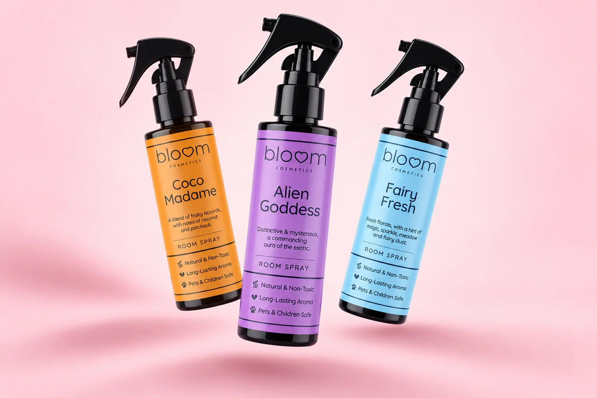 Three Bloom room spray bottles arranged with soft shadows. Choose your own scents.